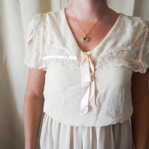 1920s-style collared lace and ribbon sheer chiffon dress.